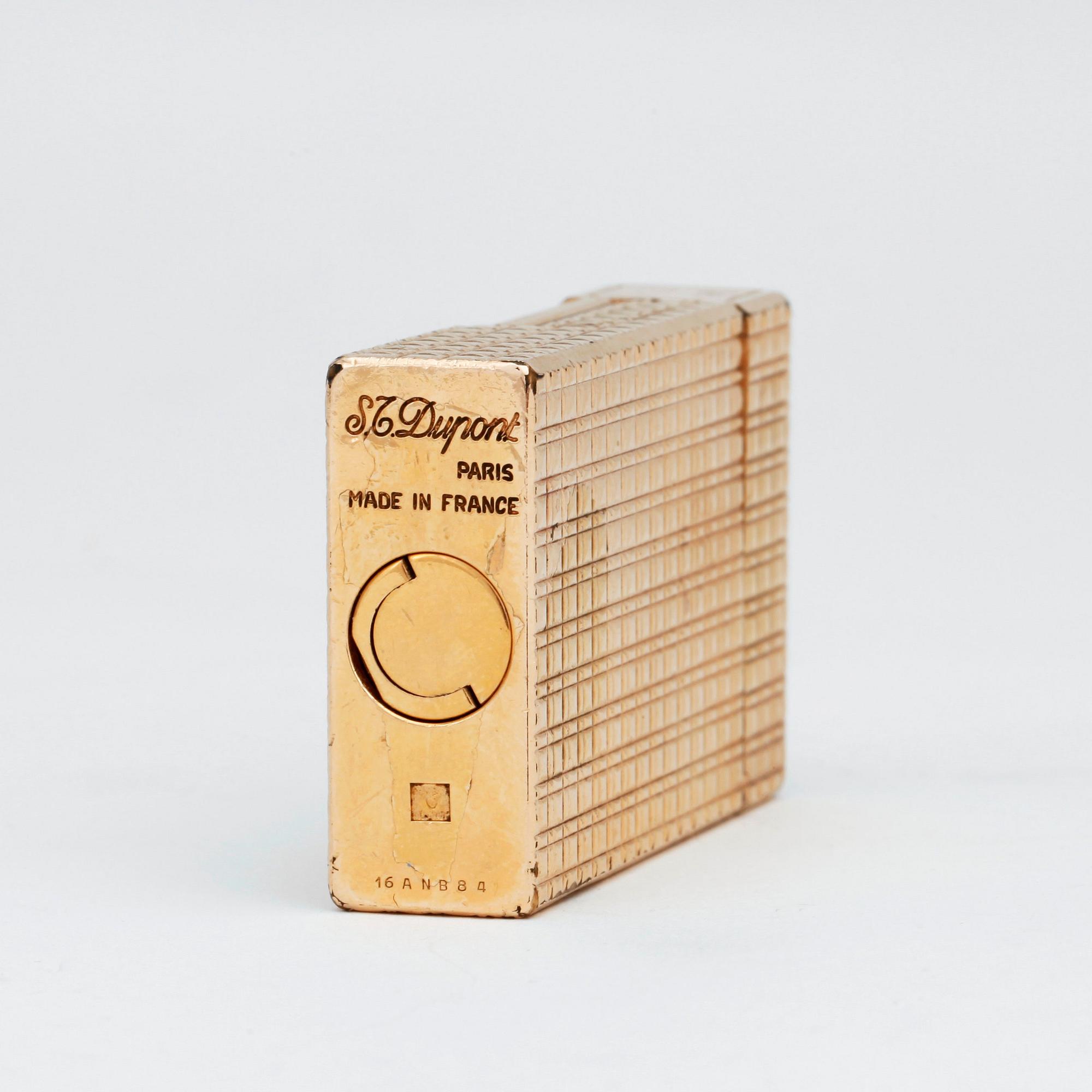 S T DUPONT, a gilded metal ligther.