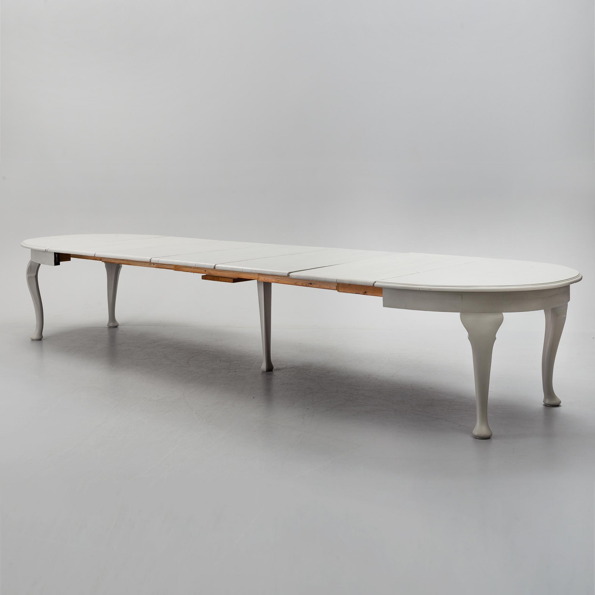 A painted Rococo style dining table, circa 1900.