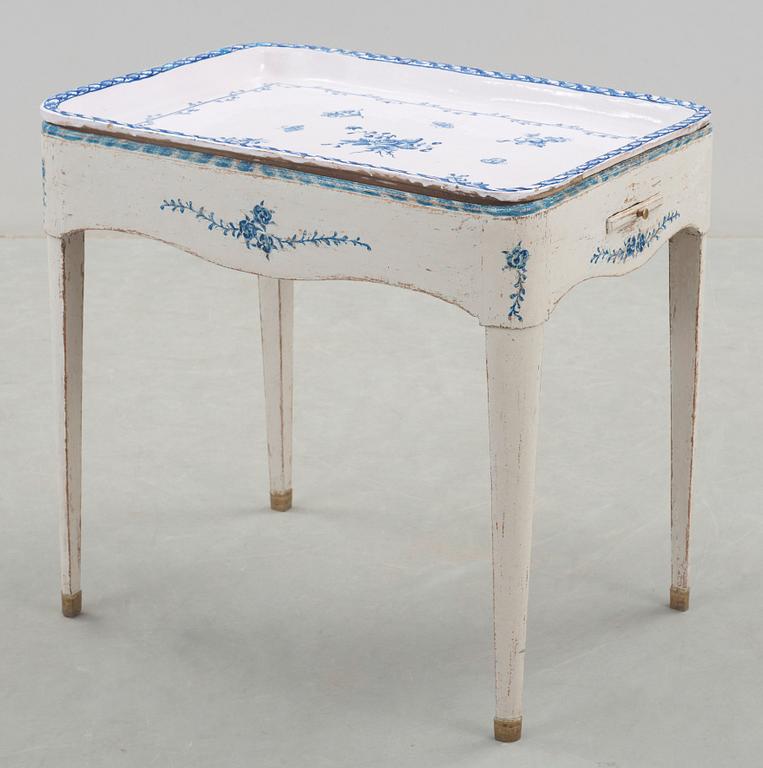 A North European 18th century faience tea table.