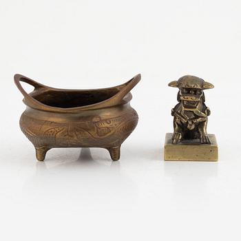 A Chinese bronze seal stamp and a tripod censer, late Qing dynasty, 19th century.