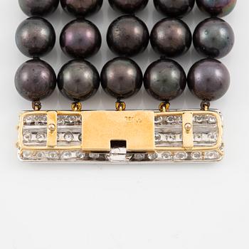 Necklace, five-row with cultured black pearls, 18K gold and white gold with brilliant-cut diamonds.