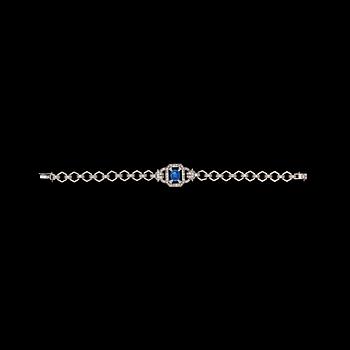 1085. A cabochon cut blue sapphire and diamond bracelet, total carat weight  circa 1.20 cts.