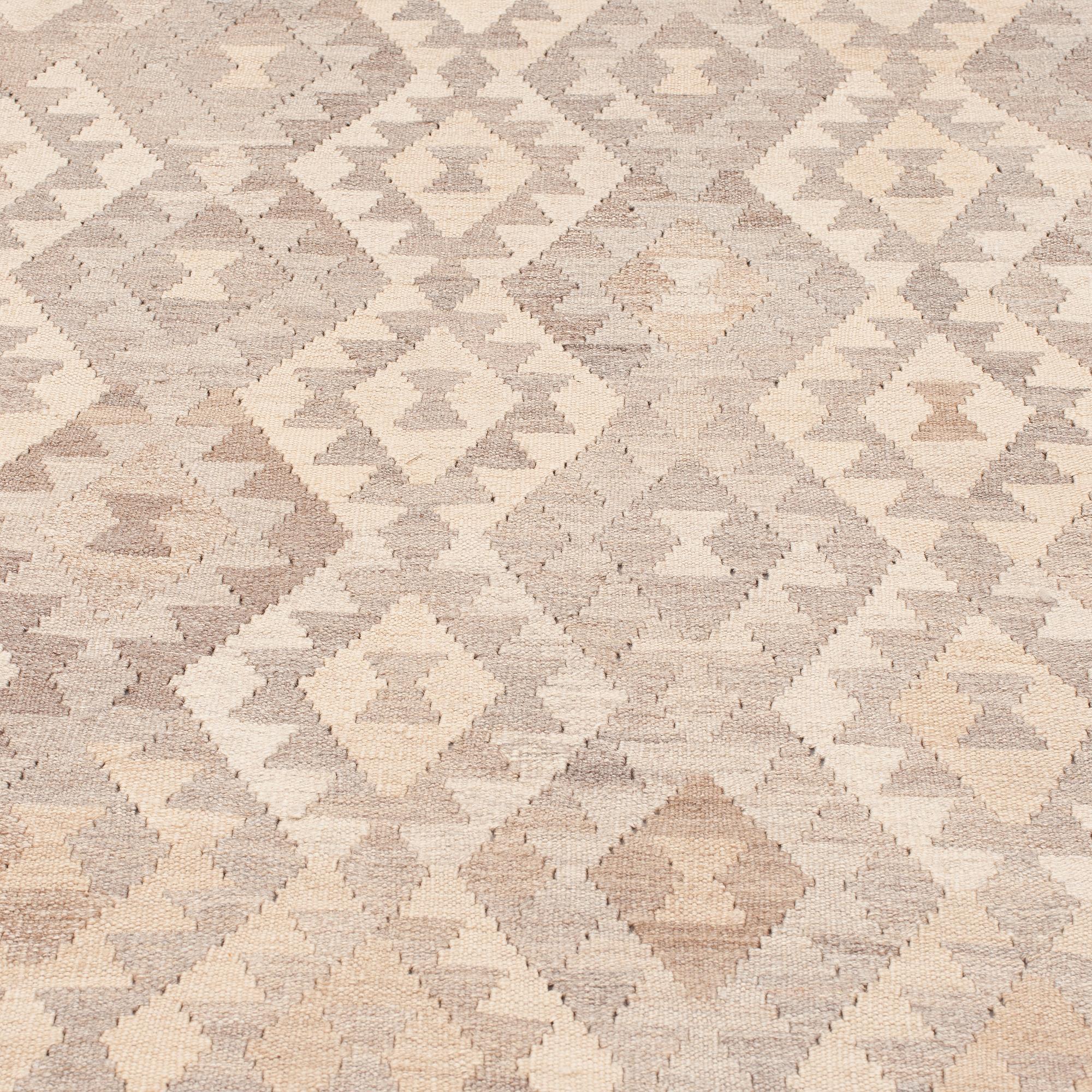 An oriental kilim, around 339 x 258 cm.