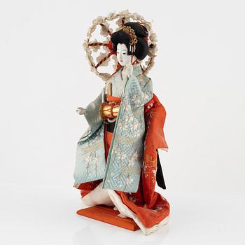 A Japanese doll, early 20th Century.