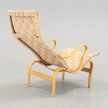 A BRUNO MATHSSON "PERNILLA 2, T. 107" BEECH AND WEBBING ARMCHAIR, Firma Karl Mathsson, Värnamo, Sweden, 1981.
