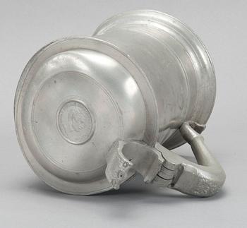 A PEWTER TANKARD,