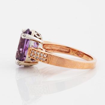 Oval faceted amethyst and brilliant-cut diamond ring.