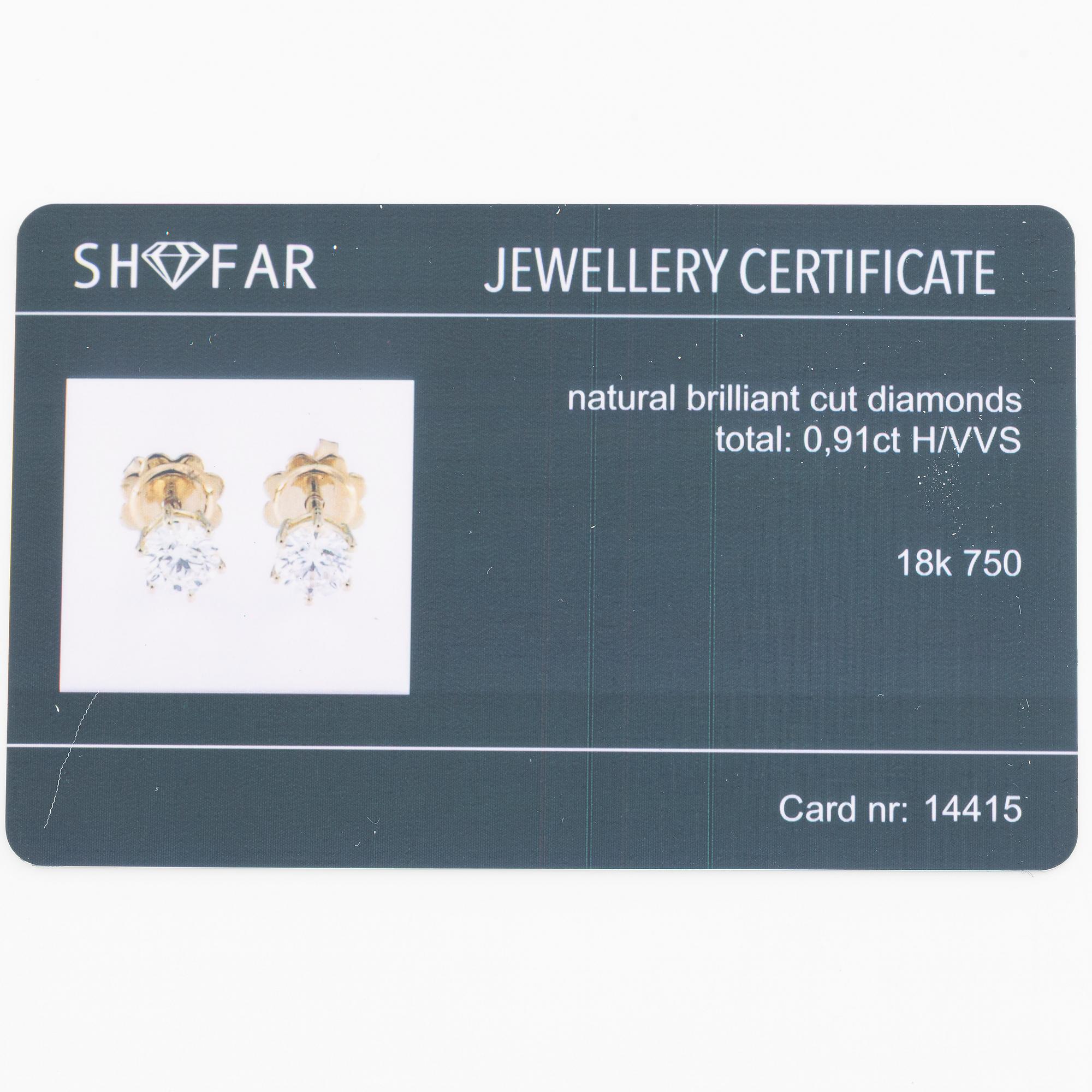 Örhängen 18K guld med briljantslipade diamanter.