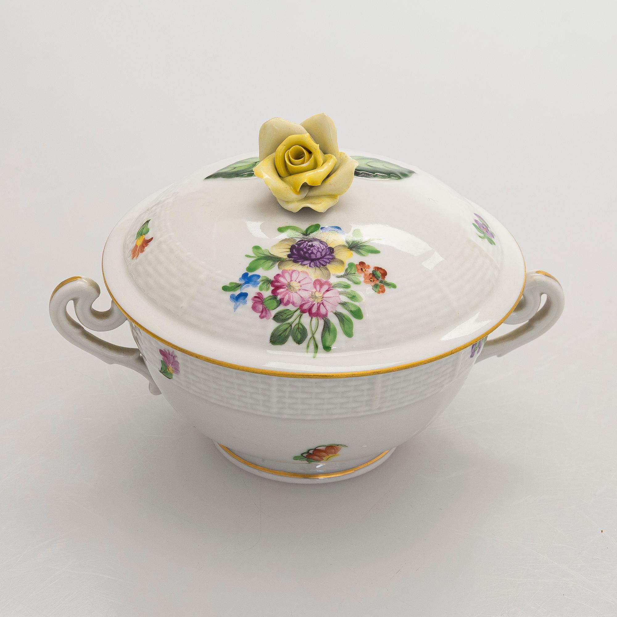 A pair of Herend porcelain candlesticks, and a lidded sugar bowl, Hungary.