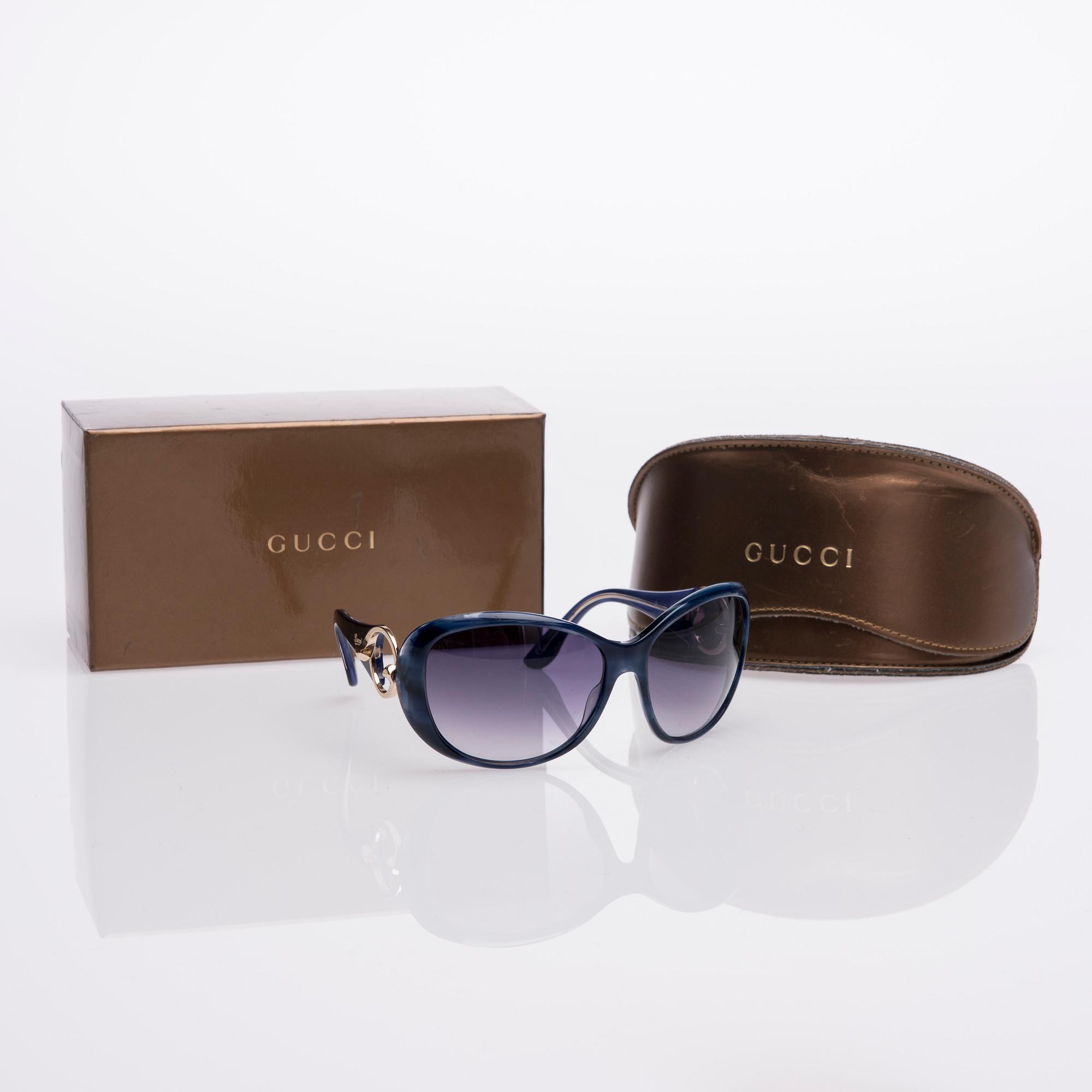 AURINKOLASIT, Gucci.