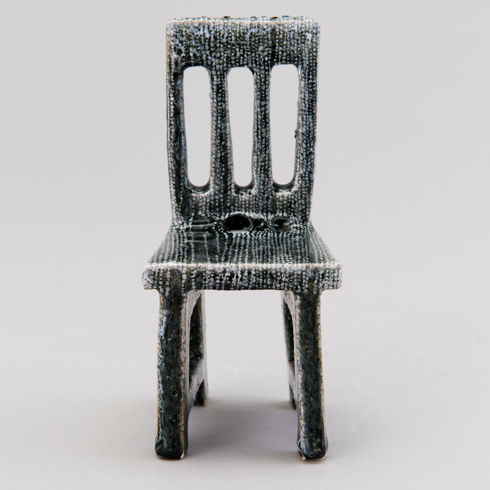 HEINI RIITAHUHTA, a porcelain miniature sculpture 'Chair' signed Heini Riitahuhta.