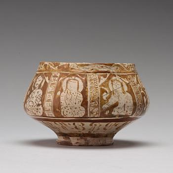 A BOWL, pottery with luster decor, height ca 10,5 cm, Persia/Iran 12th-13th century.