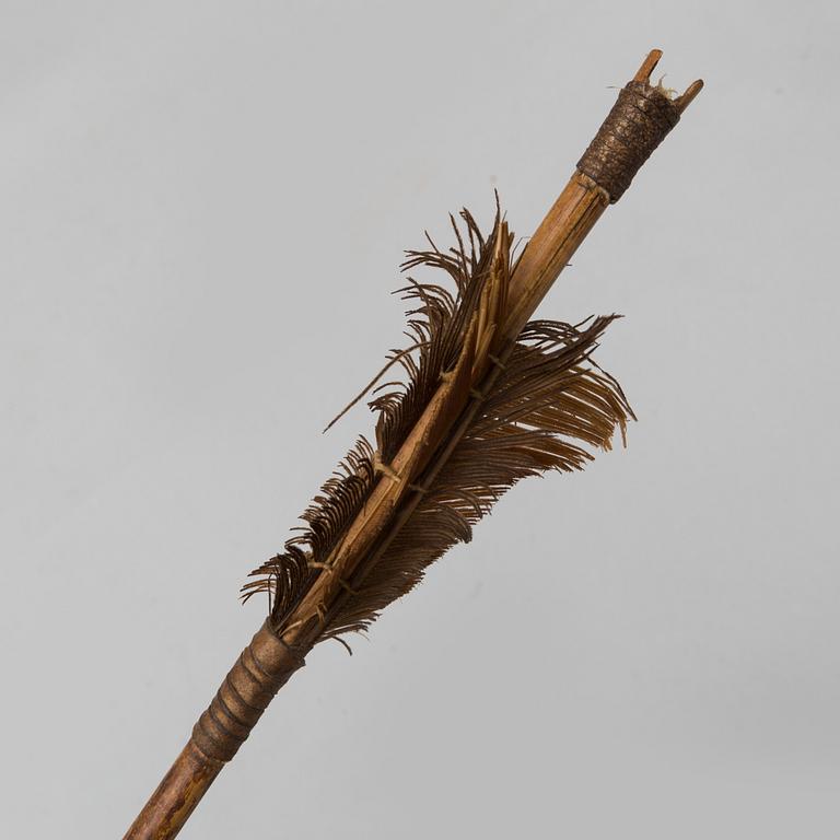 A 19th/20th century south-east asian bow with an arrow.