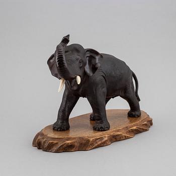 A Japanese bronze sculpture of an elephant, 20th Century. Signed.