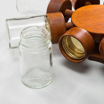 A Danish 1960s wall mounted spice rack in teak and glass from Digsmed.