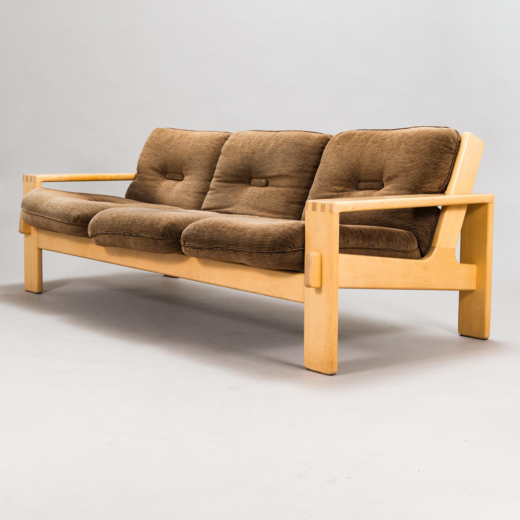 Esko Pajamies, A pair of 1970's 'Bonanza' armchairs, coffee table and sofa for Asko.