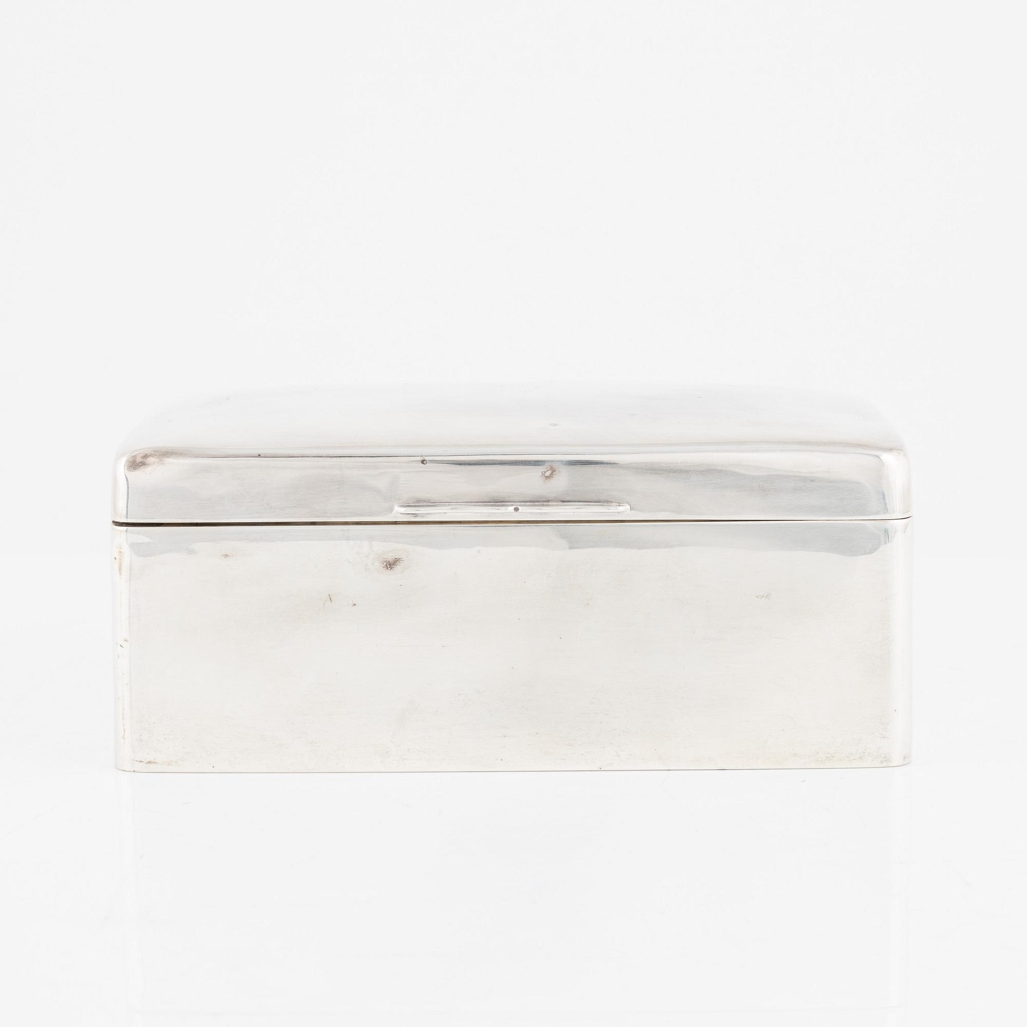 A silver cigarette box, Walker & Hall, Birmingham, England, 1919.