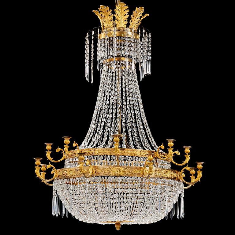 An ormolu and cut glass sixteen-branch Empire chandelier, Paris, early 19th century.