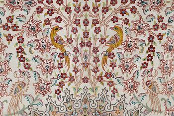 A figural Tabriz carpet, part silk, so-called 50 Raj, approx. 210 x 200 cm.