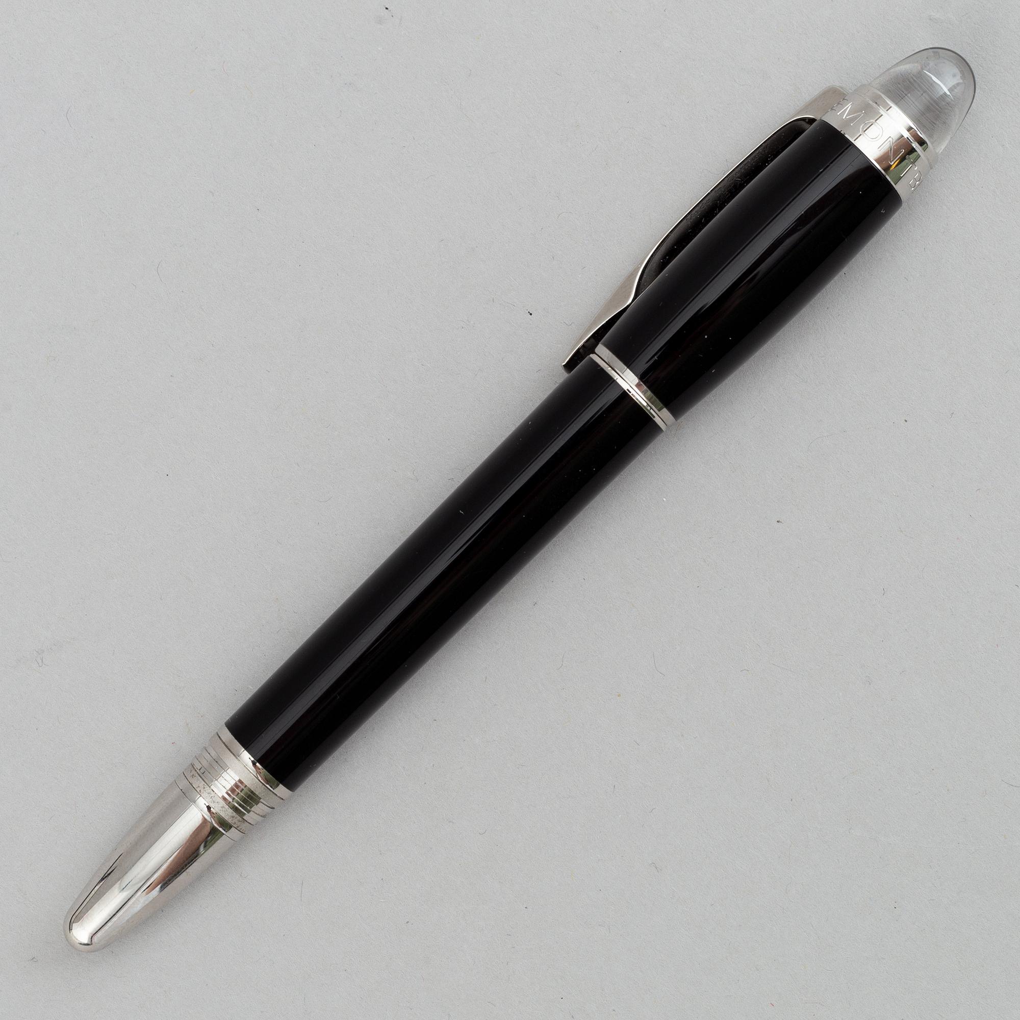 MOntblanc, a ball point pen and leather passport holder.