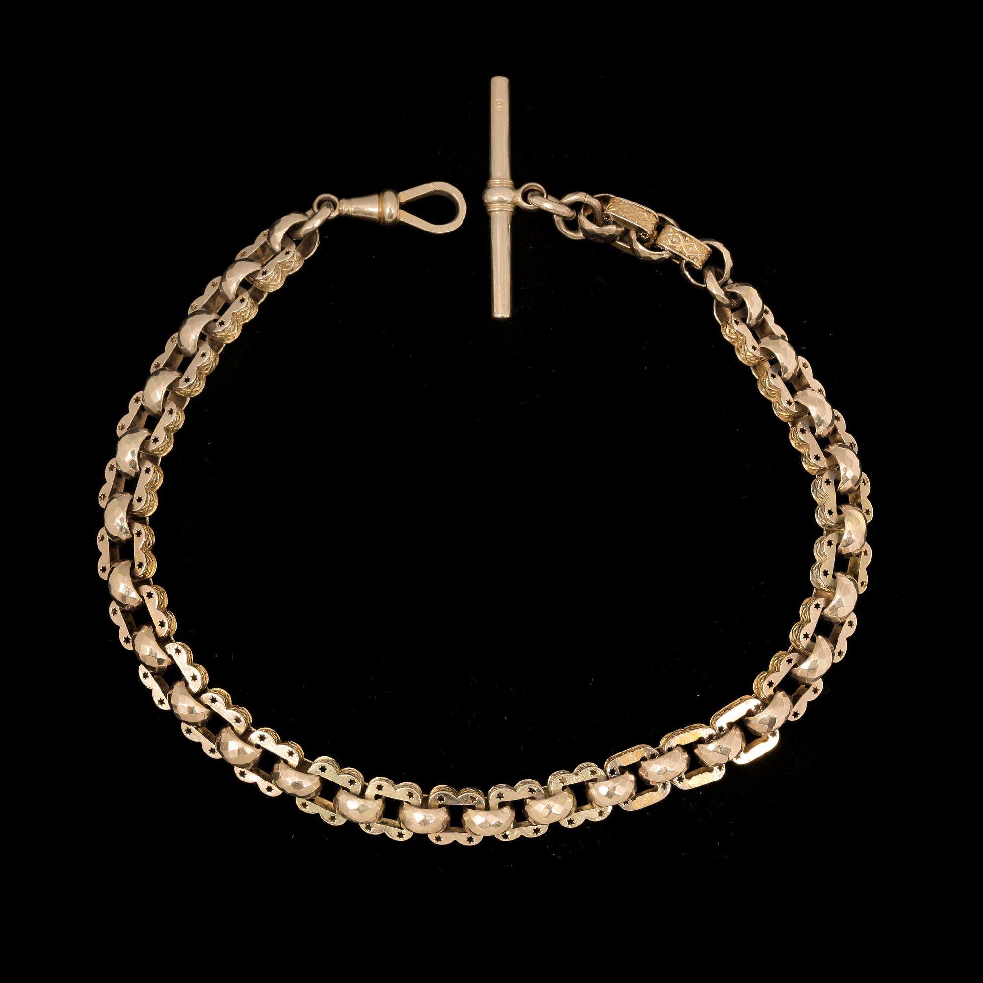 KLOCKKEDJA, 9k guld, trol England, omkring 1800/1900. Vikt 34,2g.