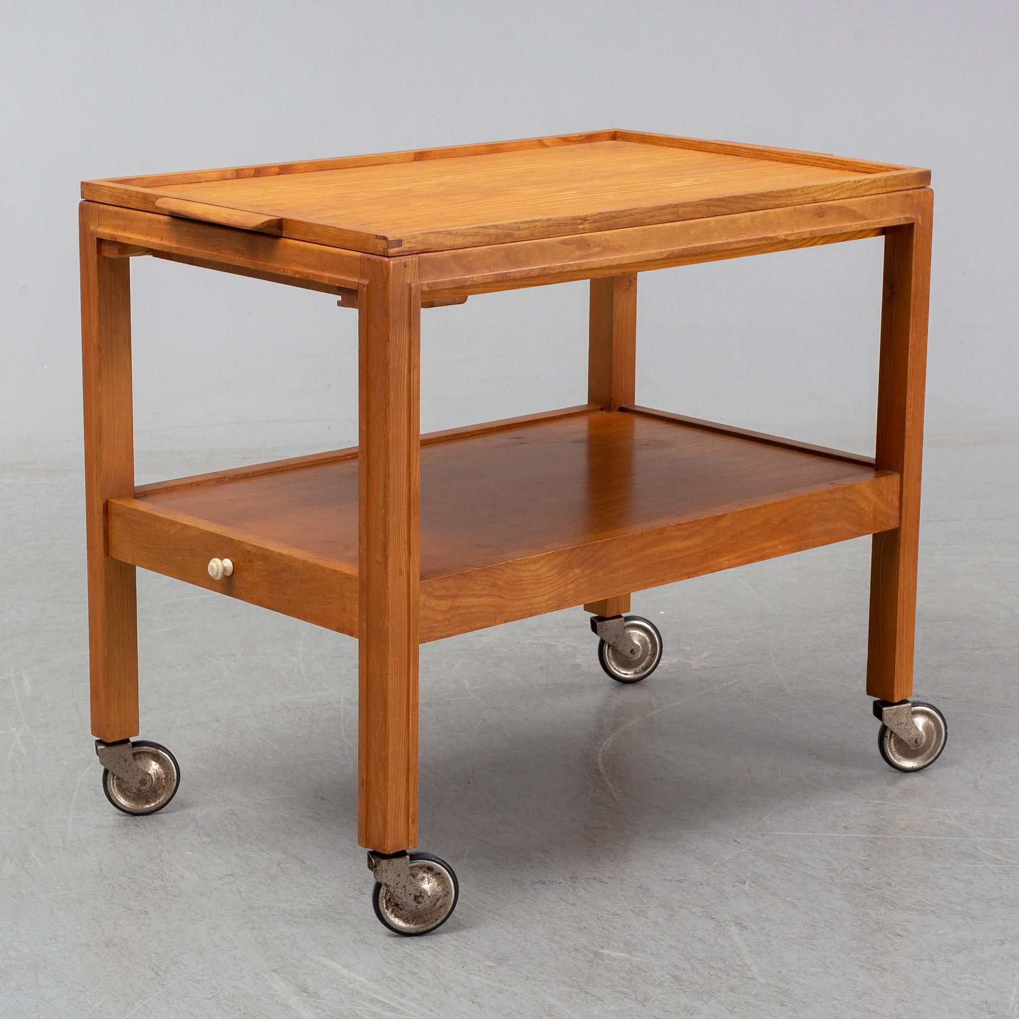 A 1930s/1940s elm veneered trolley.