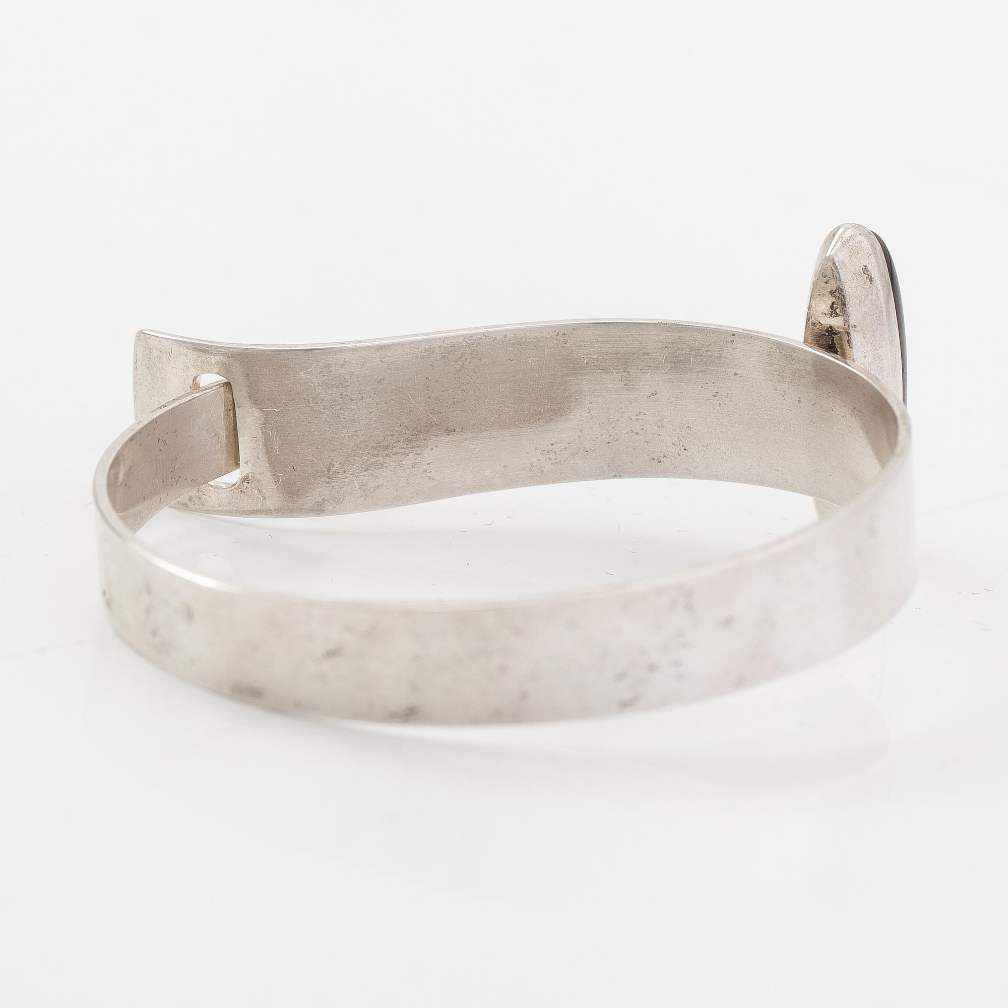 Elis Kauppi, A sterling silver bracelet with a tiger eye. Kupittaan Kulta, Turku 1961.