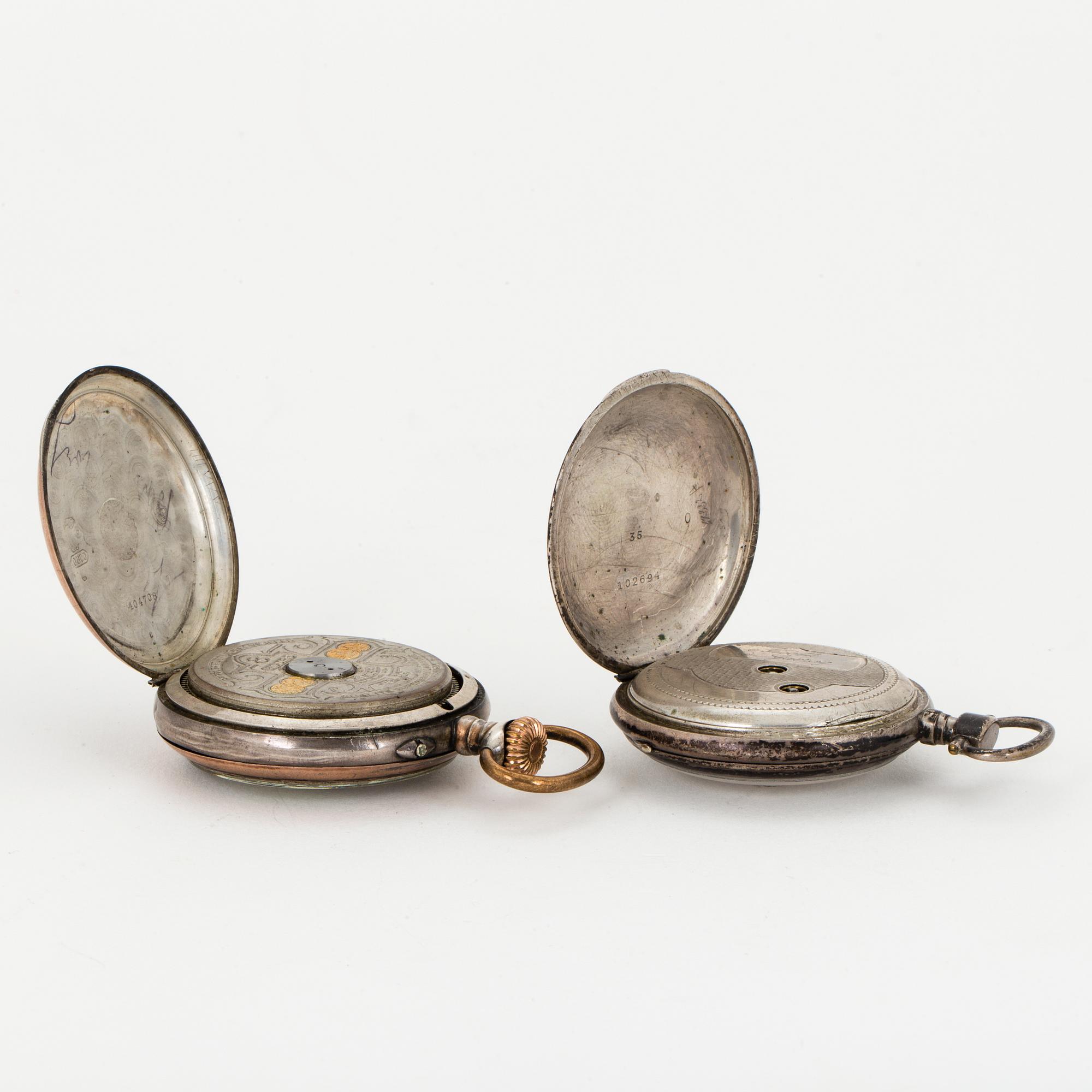 TWO POCKET WATCHES WITH STANDS.