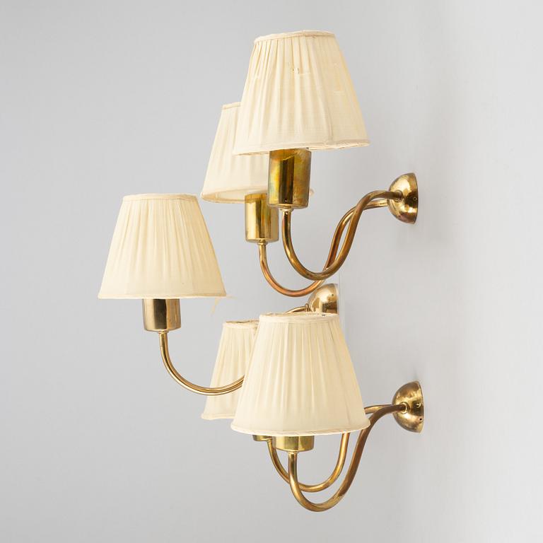 Three brass wall lamps, model 2335 and 2334, by Josef Frank, Firma Svenskt Tenn.