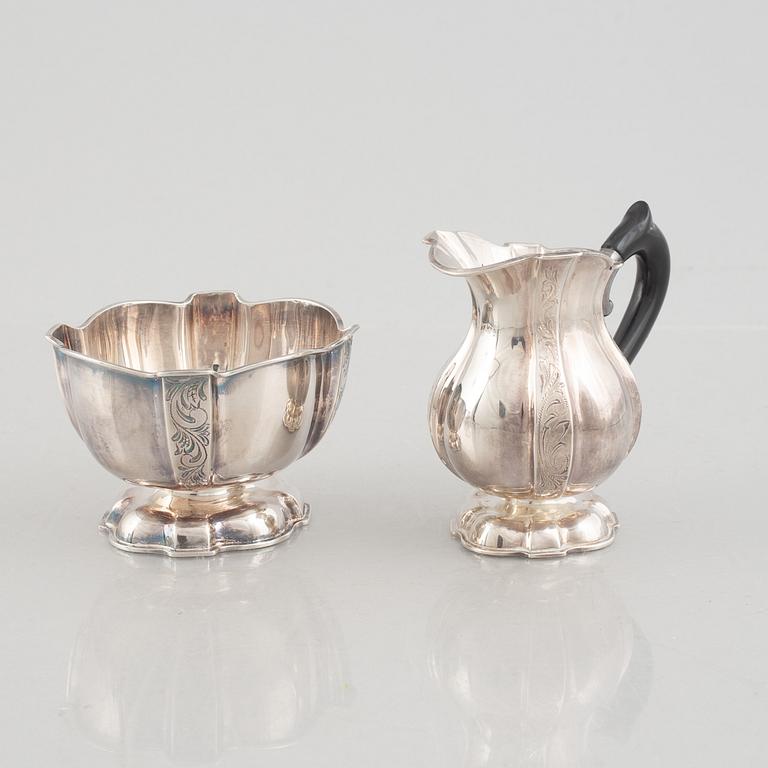 A silver coffee pot, creamer and sugarbowl, Swedish import marks, JL Hultman, circa mid-20th century.
