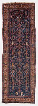 A semi-antique Northwest Persian runner, c. 388 x 94 cm.