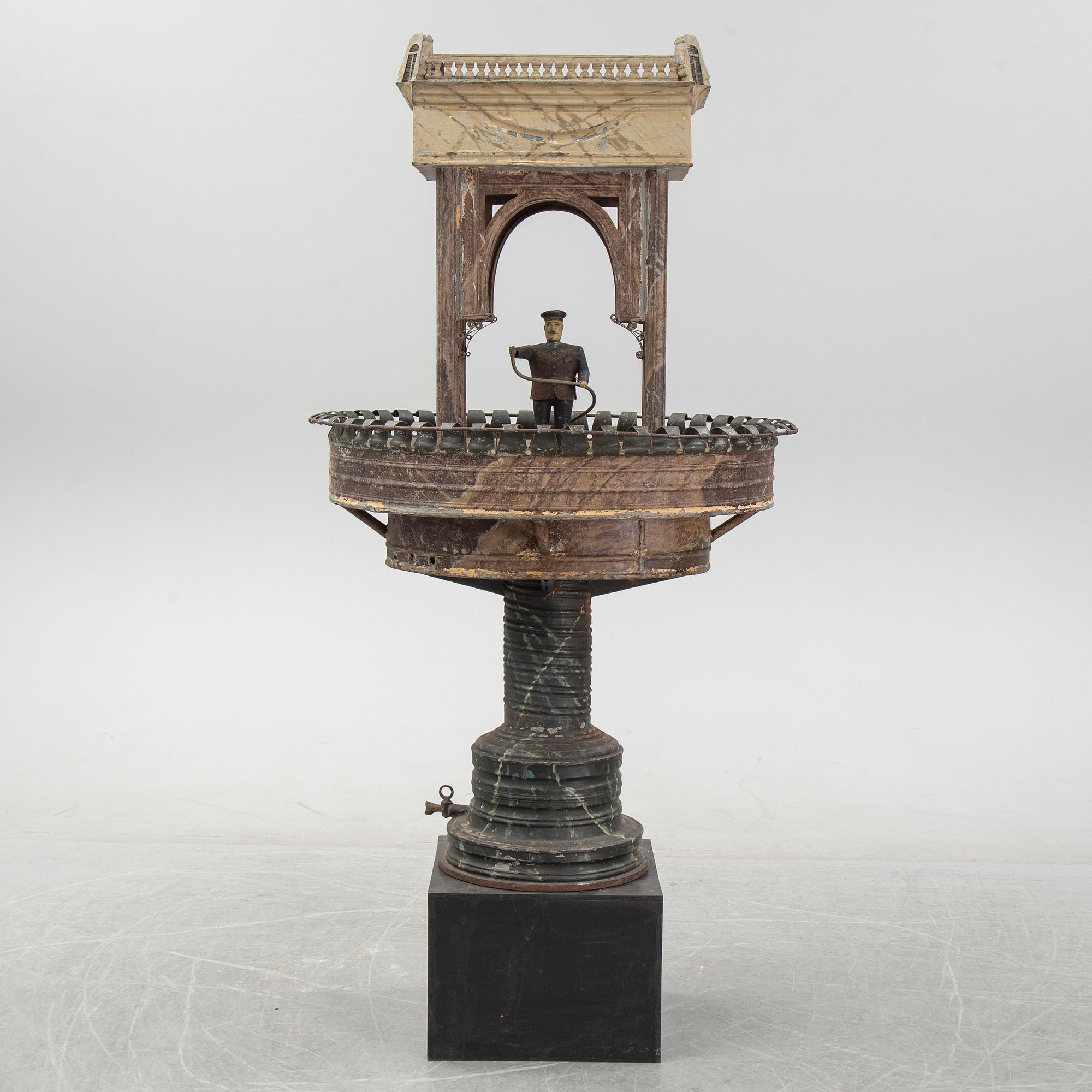 A painted and richly decorated plate garden fountain, late 19th century.