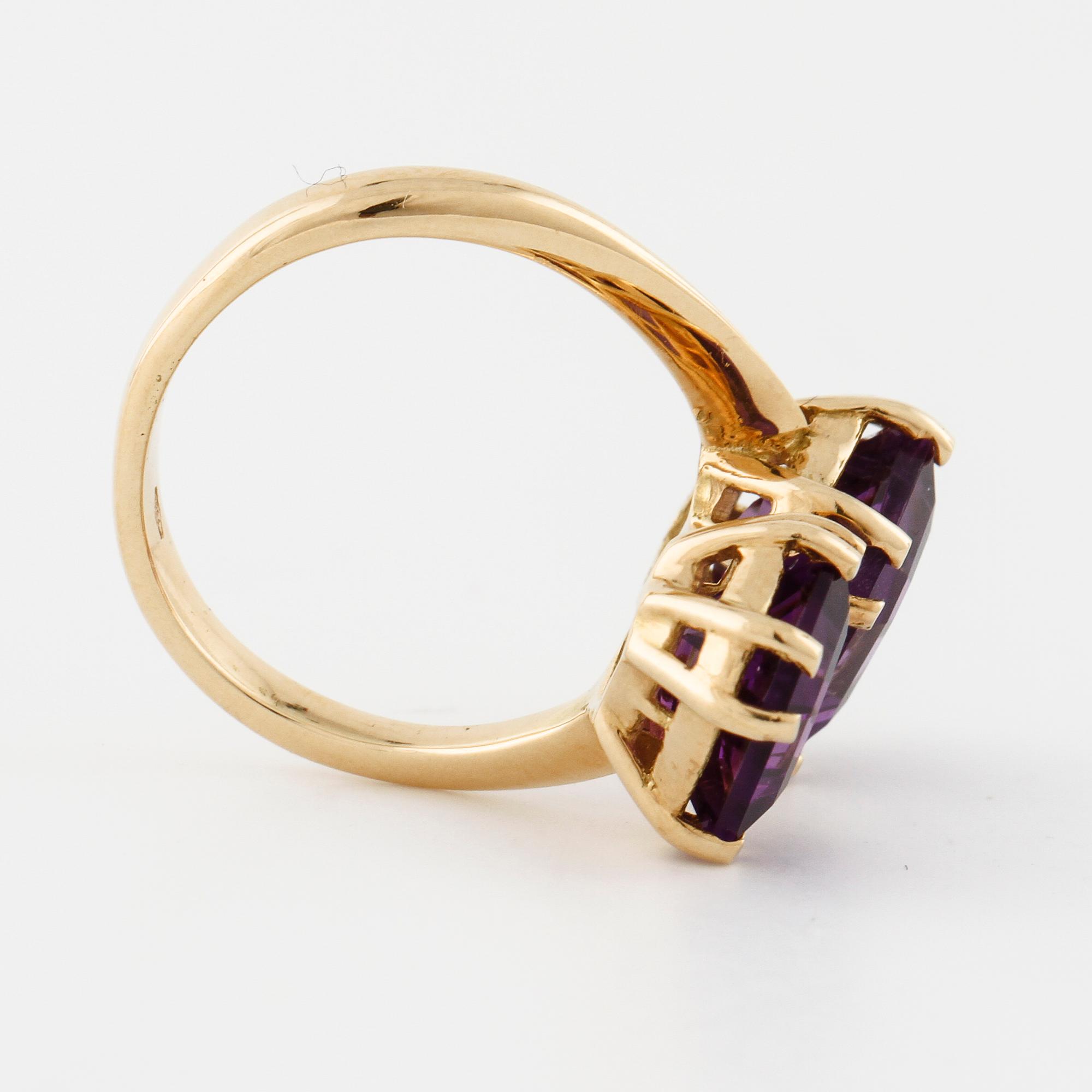 A emerald cut amethyst ring.