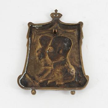 A 19th century bronze plaque.