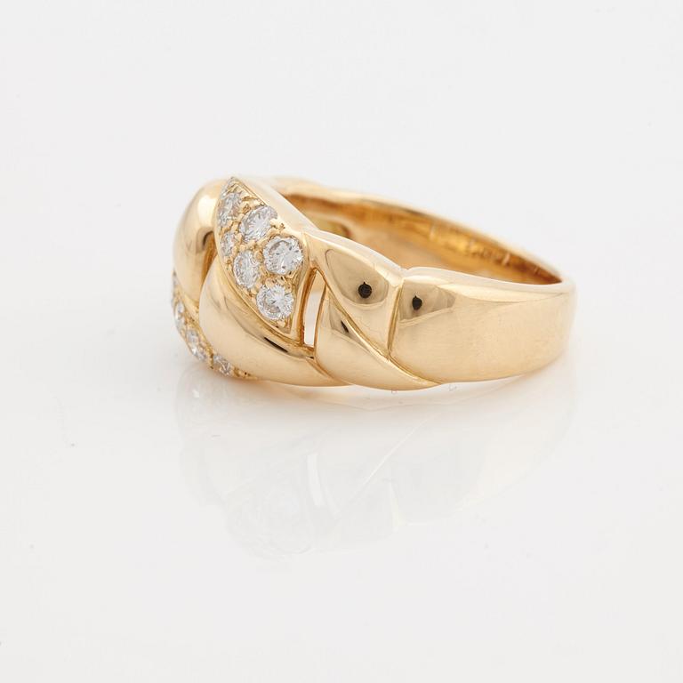 A brilliant cut diamond ring by Cartier.