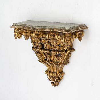 A gilt stone top table, 19th Century.