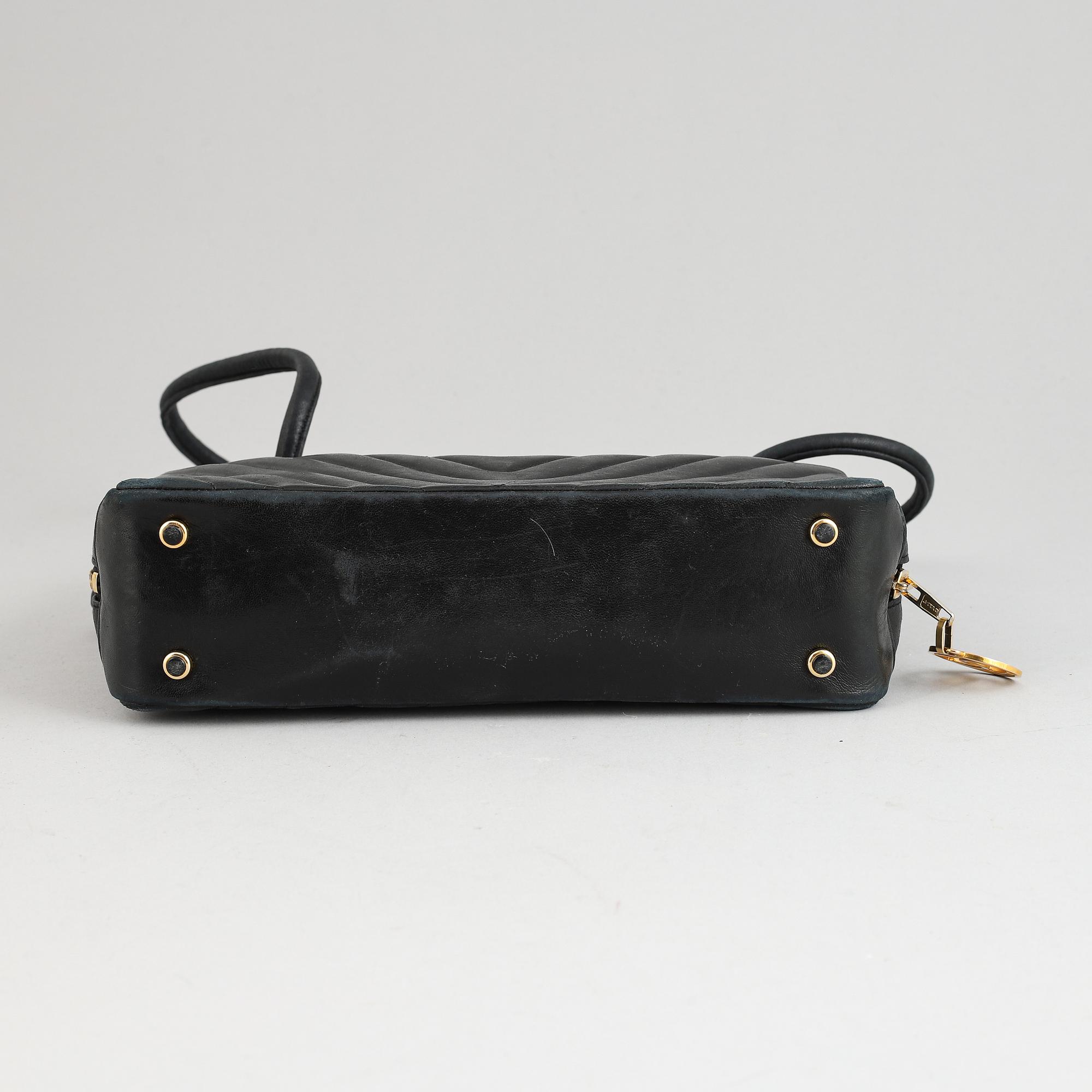 Chanel, a black leather handbag, 1980's.