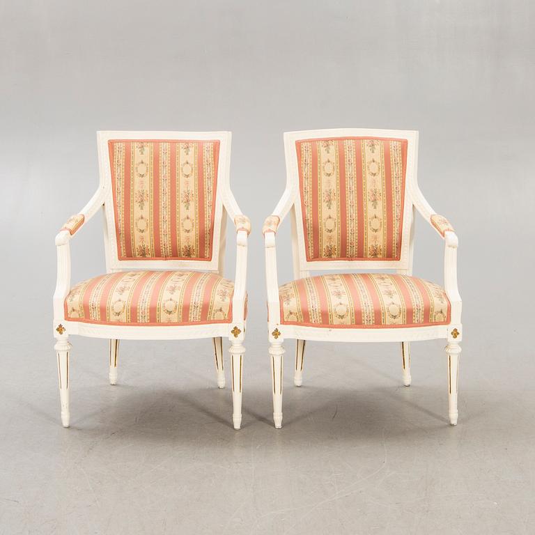A pair of Swedish painted late Gustavian armchairs around 1800.