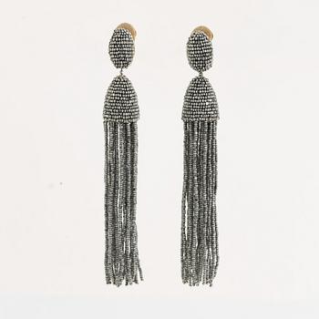 Oscar De La Renta, tassel earrings.