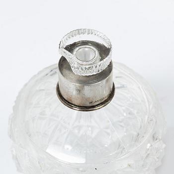 A K.Andersson silver and cut glass 'toilette set', monogrammed 'PG'. (11 pieces).