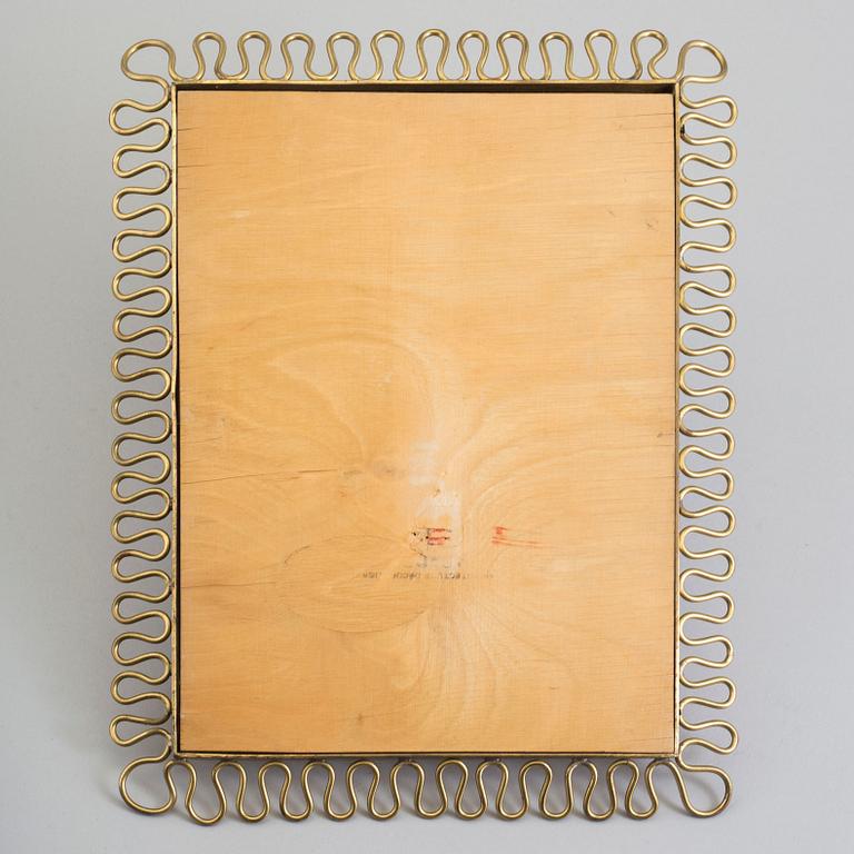 A first half of the 18th century brass mirror.