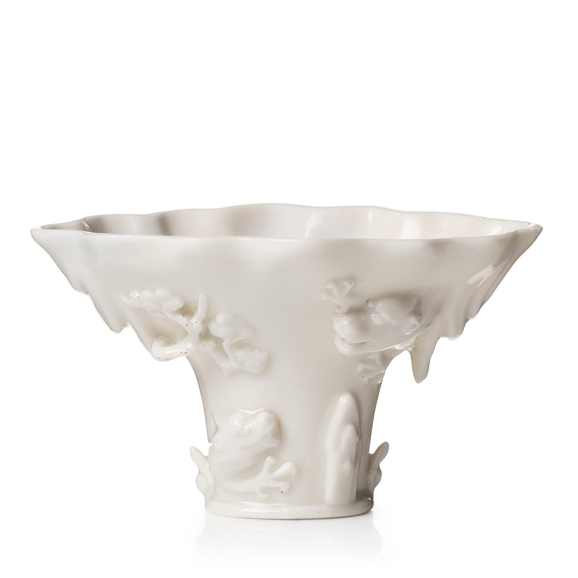 A blanc de chine rhinoserous libation cup, Qing dynasty, Kangxi (1662-1722).