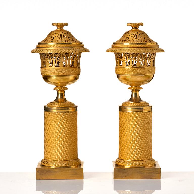 A pair of French Empire candlesticks, early 19th century.