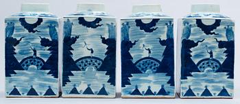 A set of four blue and white large tea caddies in a wooden box, Qing dynasty, circa 1900.