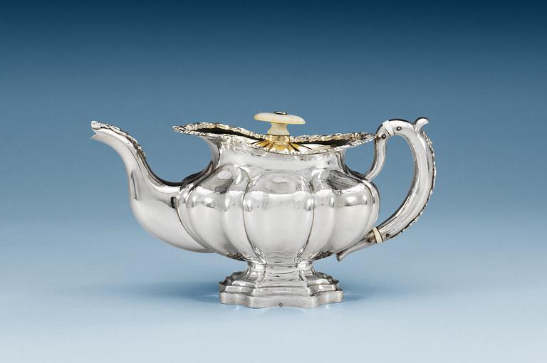 A RUSSIAN PARCEL-GILT TEA-POT, makers mark of Adolf Sper, St. Petersburg 1842.