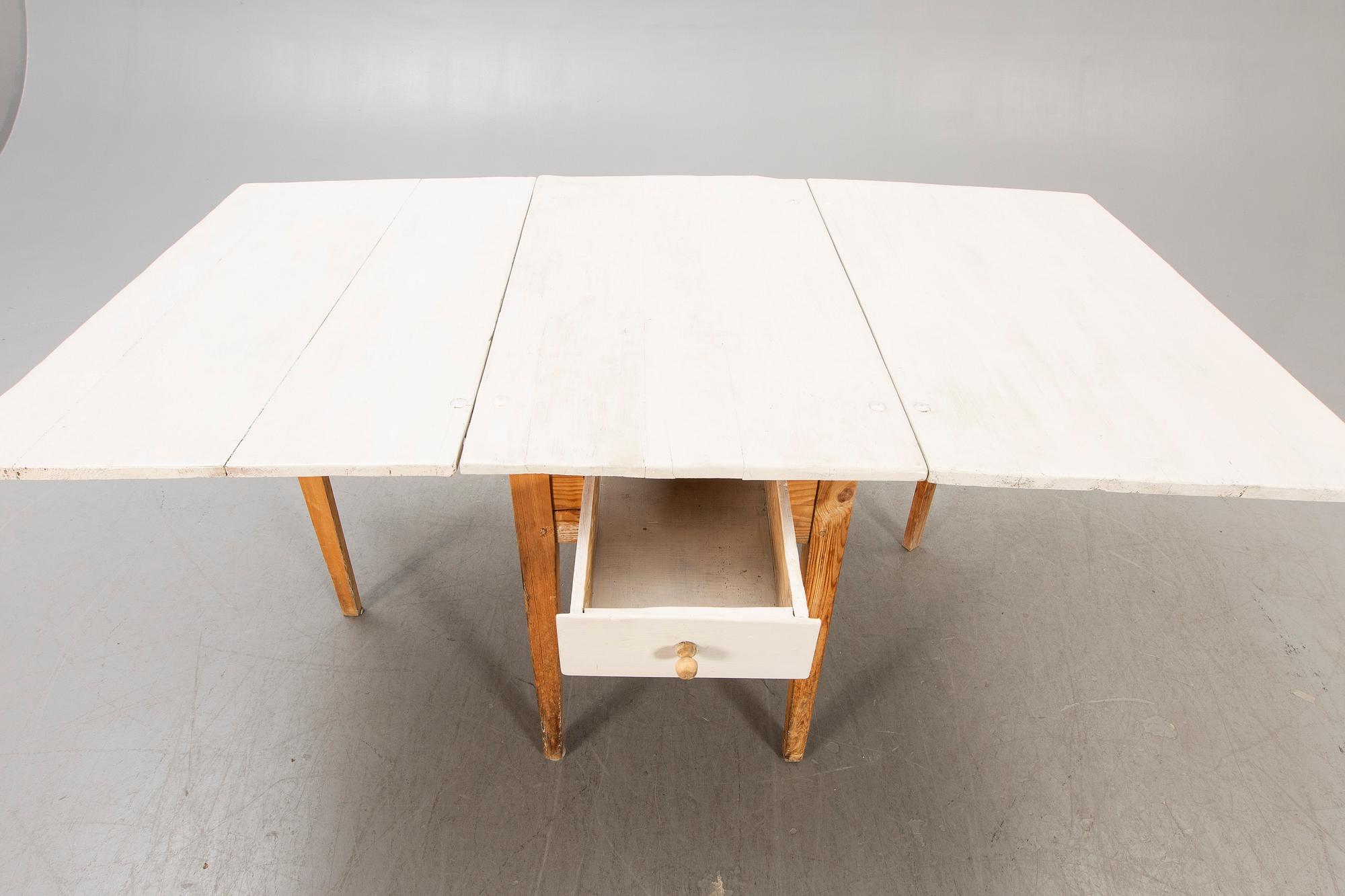 A painted gate legged table later part of the 19th century.