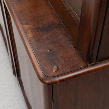 Empire, A late Empire book cabinet, first half of the 19th century.