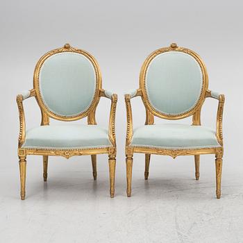 A sofa and a pair of chairs, Louis XVI style, circa 1900.