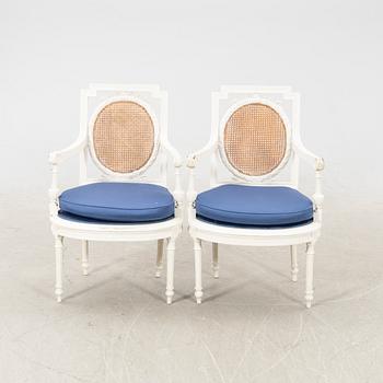 A pair of painted rattan Louis XVI style armchairs first half of the 20th century.