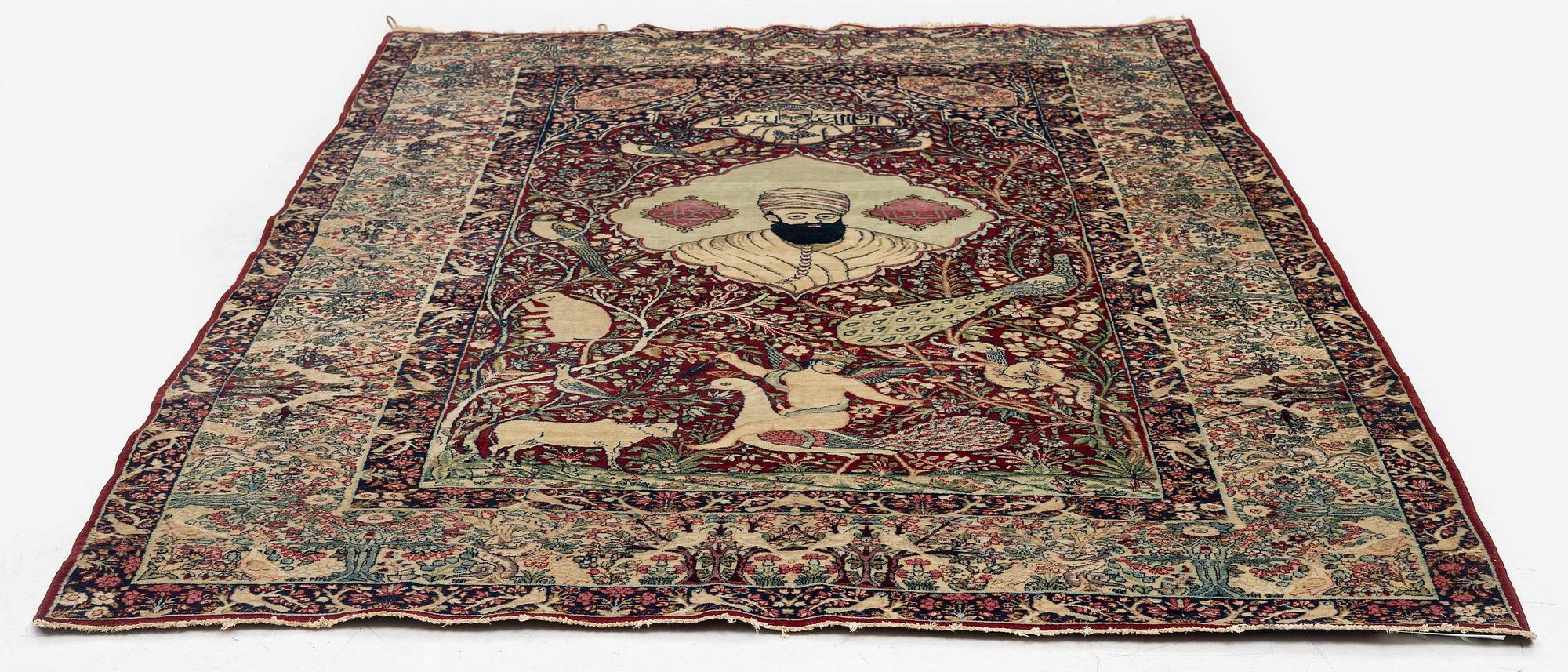 An antique Kirman Laver figural, Southeastern Iran, c. 220 x 135 cm.